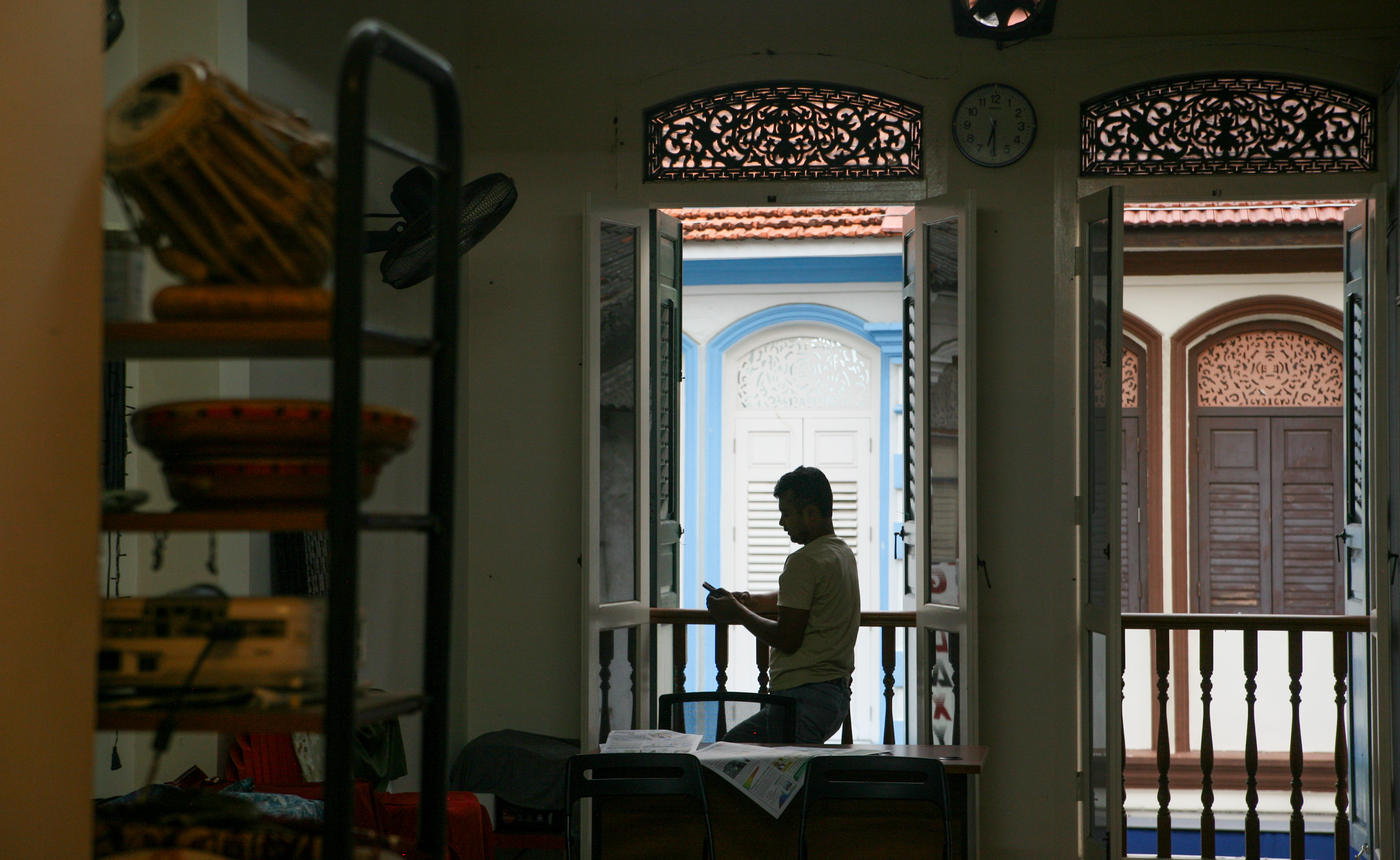 a man standing by a window